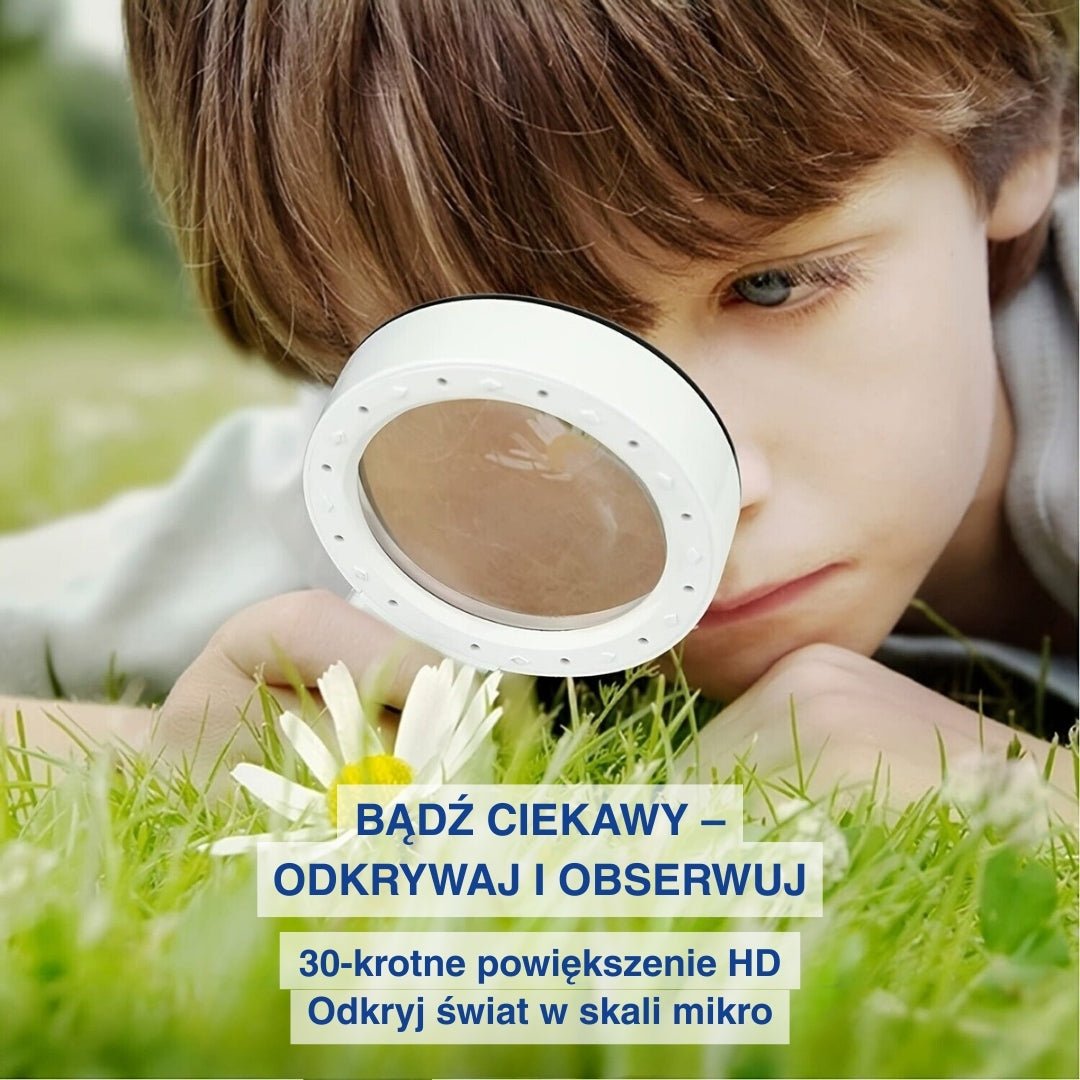 Dziecko oglądające kwiat na polu przez lupę z oświetleniem LED.